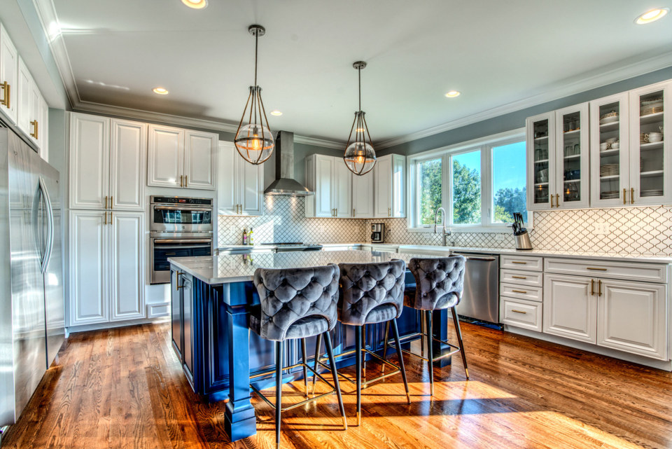 DOOR STYLE: Hartford COLOR: Bright White (Perimeter) and Smoky Blue (Island)