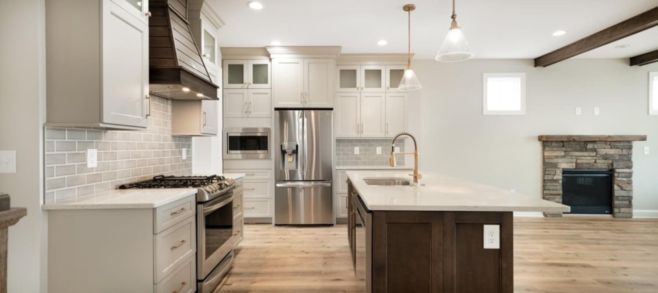DOOR STYLE: Salem II in Willow Gray on perimeter and Ash with Vintage Glaze stain on island and hood @lilyanndesign with ProStock Kitchens