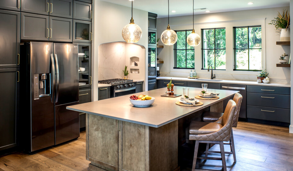 designed and created by Meliora Cabinetry in Hendersonville, NC Door Style/Colors: Eudora – Maple Lancaster Door in Iron (Perimeter) and Maple Ash (Island)