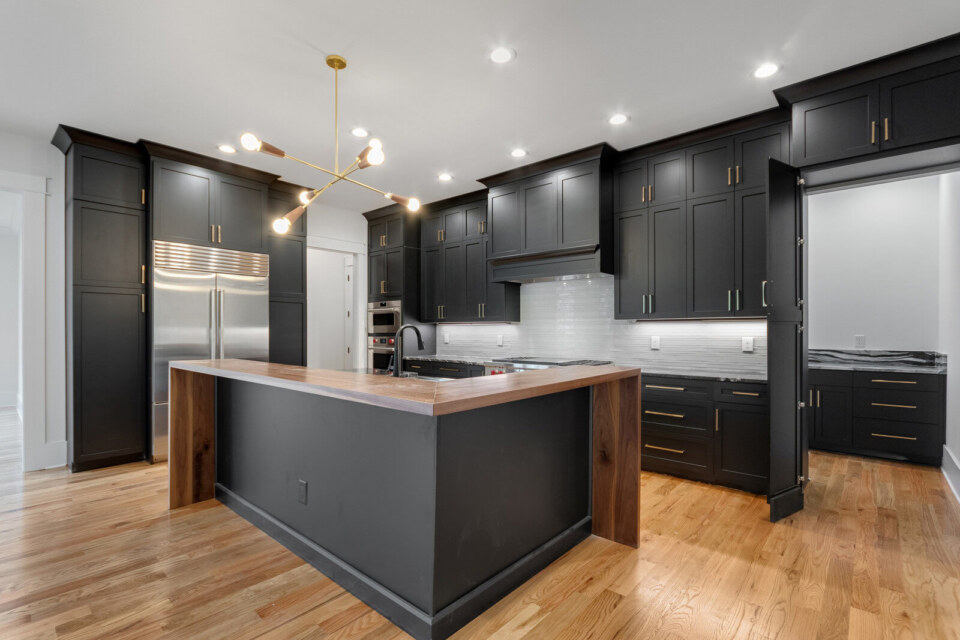Cottage Door in Ebony featuring a Charlotte Designer Hood