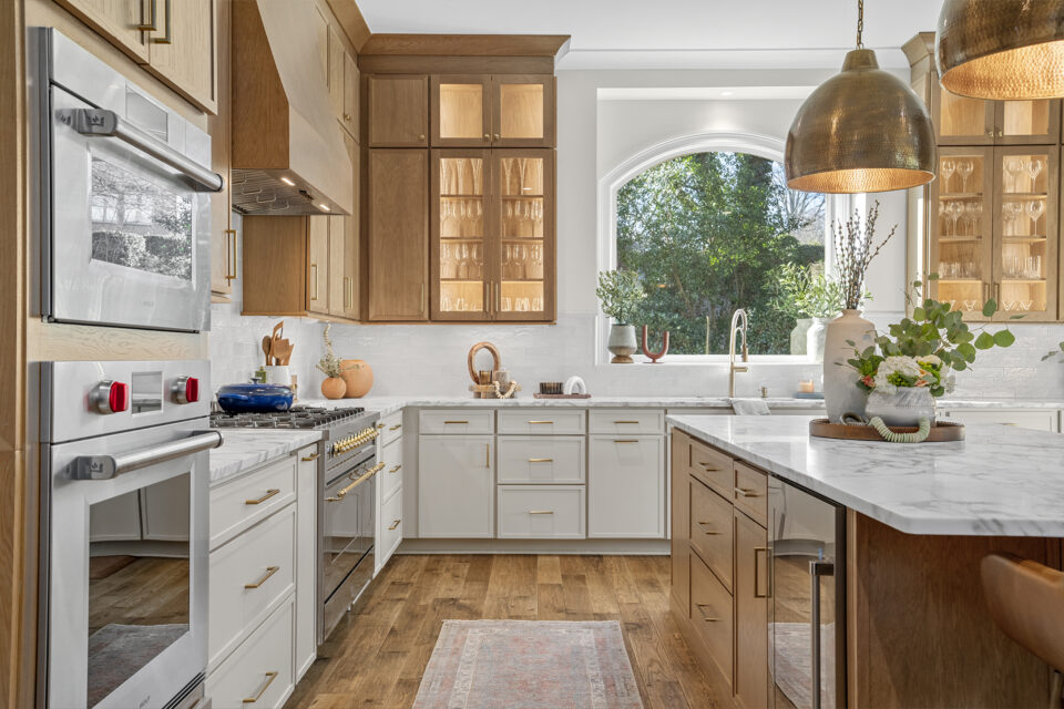 Created by Haggard Home Cabinetry & Design Door Style/Color: Portrait Oak Sand and Portrait Maple Beige