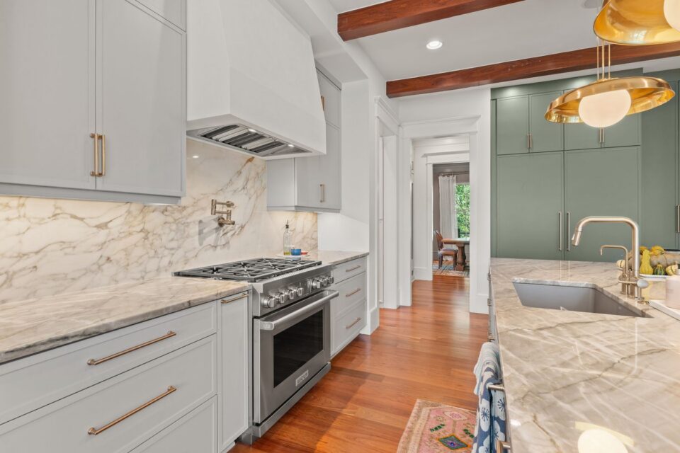 Created by Jilco Kitchen and Bath - Charleston, SC Builder: CMG Custom Homes Designer: Michaela Jorgensen Door Portrait in Oyster Refrigerator Wall: Portrait door in Thunder